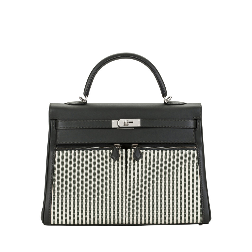 Hermes Black Kelly bag in textured calf leather with black and white stripes on the front by The Ornamental